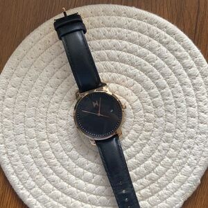 MVMT rose gold watch with black leather strap